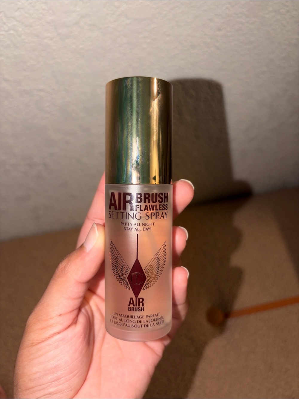 Charlotte tilbury air brush flawless setting spray.